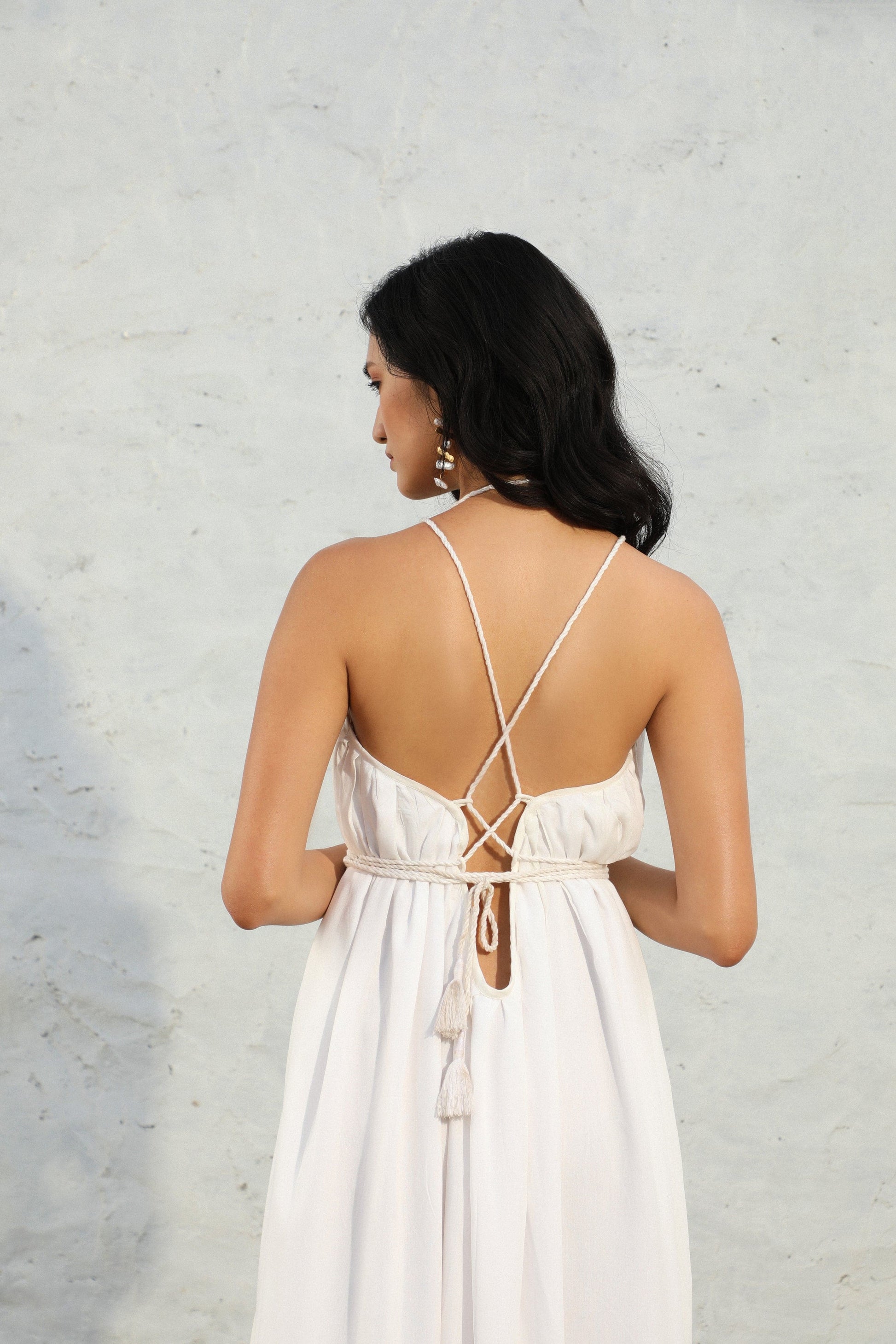 white reverie dress back pose 